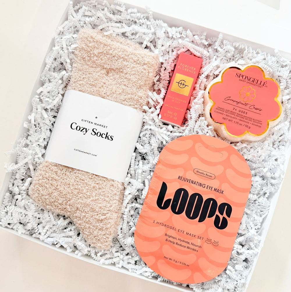 Set of cozy socks and sponge buffer in a gift box with 'LOOPS' branding.