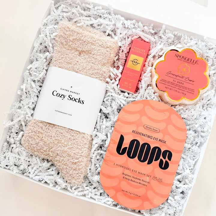 Set of cozy socks and sponge buffer in a gift box with &