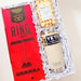 Gift set with 'Ring' box, YETI tumbler, and popcorn in a decorative box with a blue ribbon.
