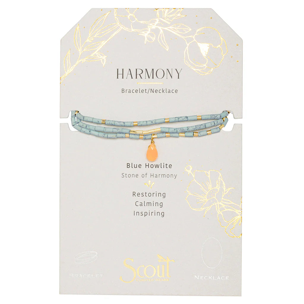 Jewelry by Scout Curated Wears showcases a multi-strand Blue Howlite Harmony bracelet and necklace on a decorative grey card featuring marbled light blue stones, gold-tone spacers, and a central peach teardrop charm