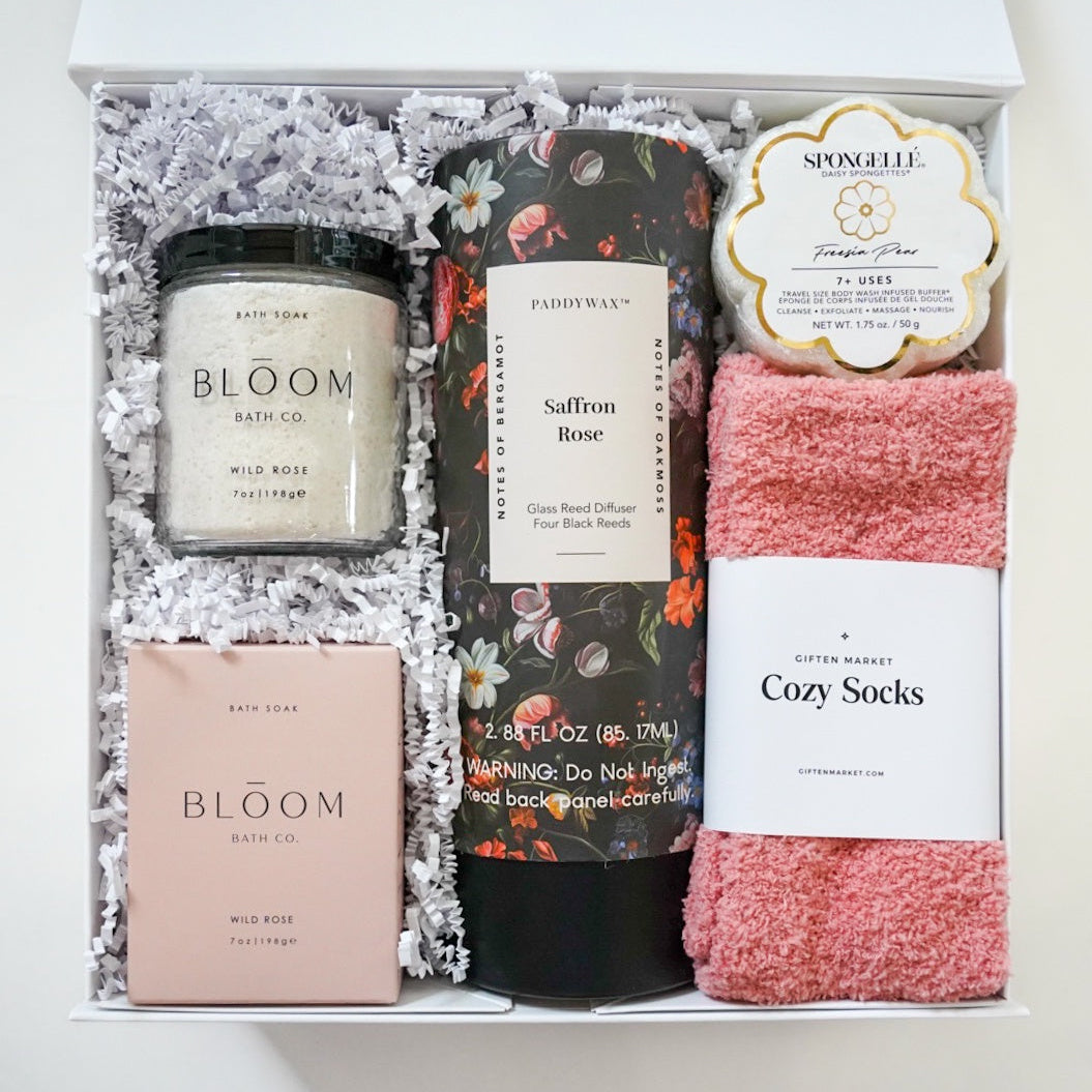 Gift set with candles, soap, and socks in a box
