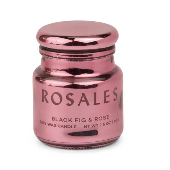 Glass and soy wax candle by Rosales featuring a Black Fig & Rose scent in a reflective metallic pink jar with a matching lid and bold black lettering set against a plain white background