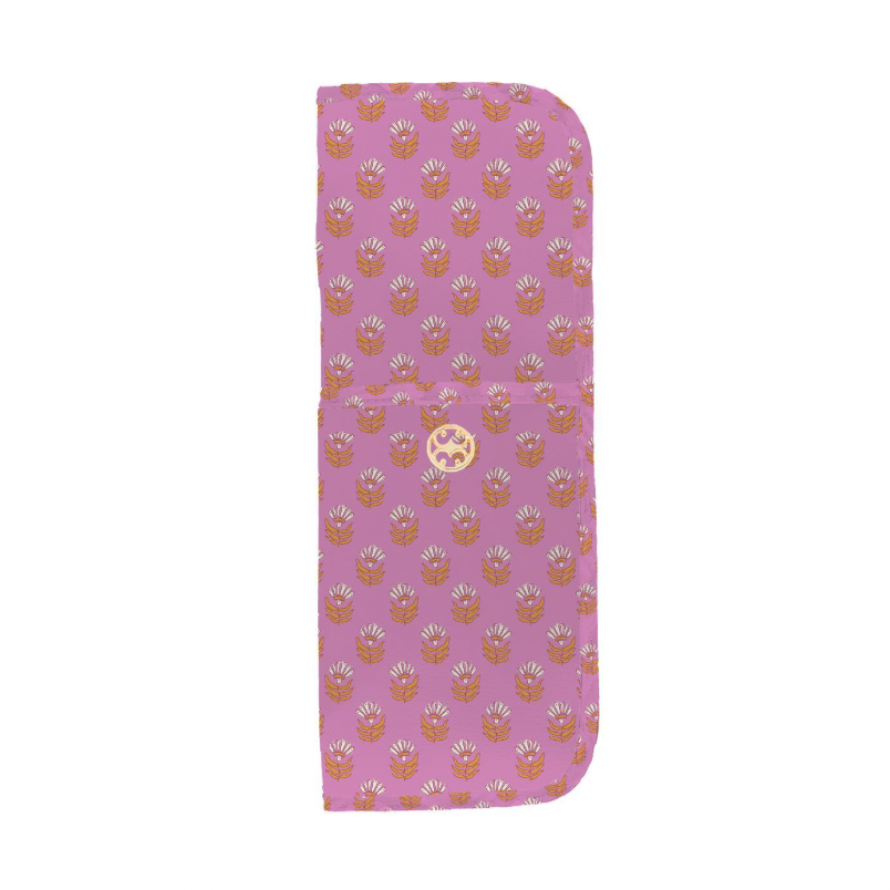 Hand-block printed textile travel pouch featuring a repeated ochre and white botanical pattern on a dusty pink background with a central decorative gold-tone circular logo emblem