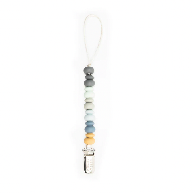 Silicone pacifier clip by Bella Tunno featuring a vertical string of multi-colored abacus-style beads in muted shades of grey, mint, and blue with a single yellow accent bead and a silver metal clip against a plain white background