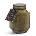 Soy wax candle by Paddywax featuring the Wild Neroli fragrance in a faceted olive green glass jar with an embossed P seal, a matching glass lid, and a colorful floral tag against a white studio background