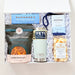 Gift box with snacks and a Yeti cooler on a white background