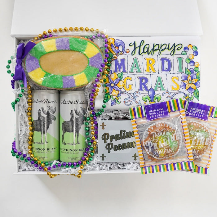 Mardi Gras-themed gift set with beads and decorative items on a white background
