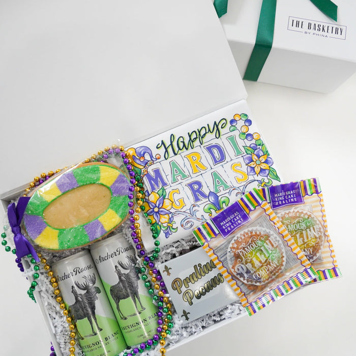 Mardi Gras-themed gift set with a card and decorative items on a white background