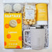 Gift box with Partake lemon product, mug, and other items on a white background