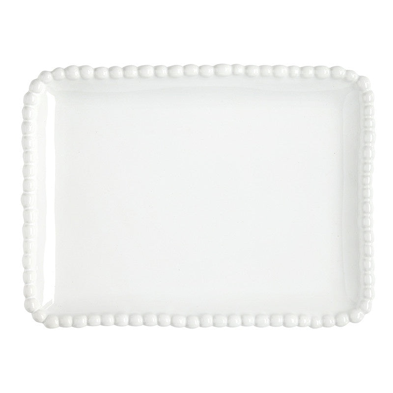 White glazed ceramic stoneware platter by Juliska featuring a rectangular serving tray with a raised berry-like beaded border and a glossy finish against a plain white background