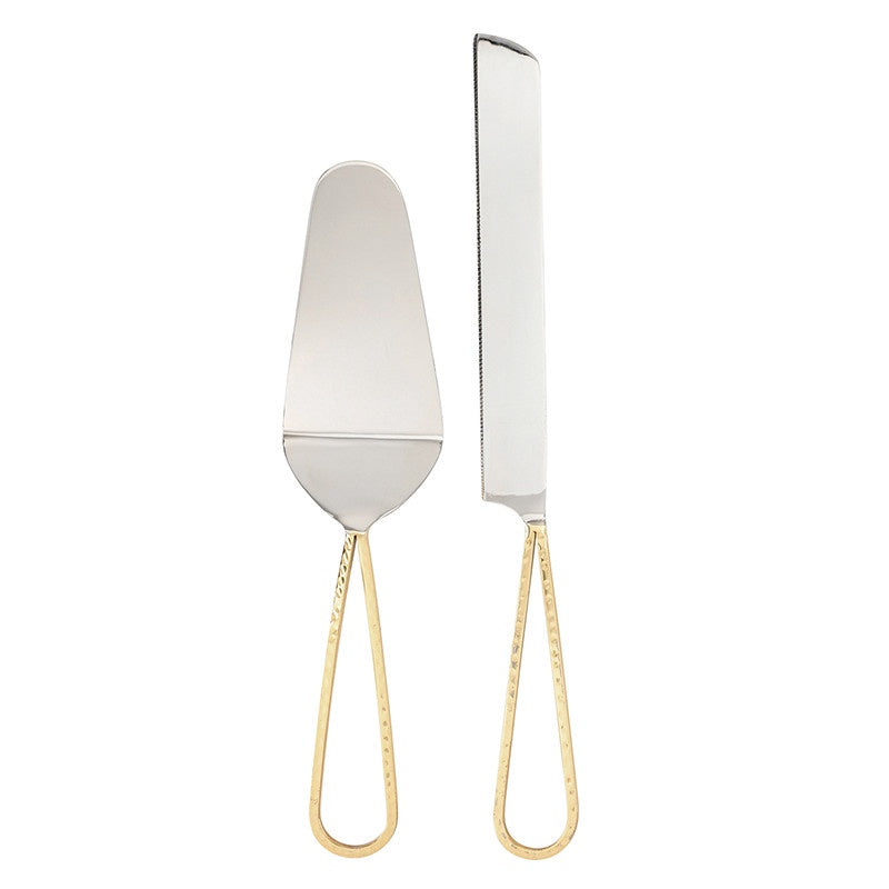Polished stainless steel cake serving set featuring a server and serrated knife with elegant hammered gold-tone teardrop handles against a minimalist white background