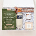 Gift set with beef jerky, YETI mug, and other items in a clear box.