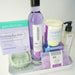 Collection of skincare and wellness products on a tray with a white background