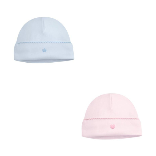 Product photograph of two soft cotton knit baby beanies on a white background featuring a light blue hat with an embroidered star and a pale pink hat with a small heart both finished with decorative scalloped trim along the brim