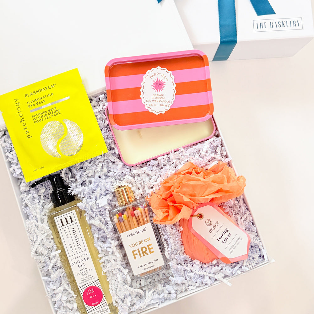 Gift set with skincare products and a soap on a white background