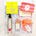 Set of skincare products including bottles, a pouch, and a box on a white background