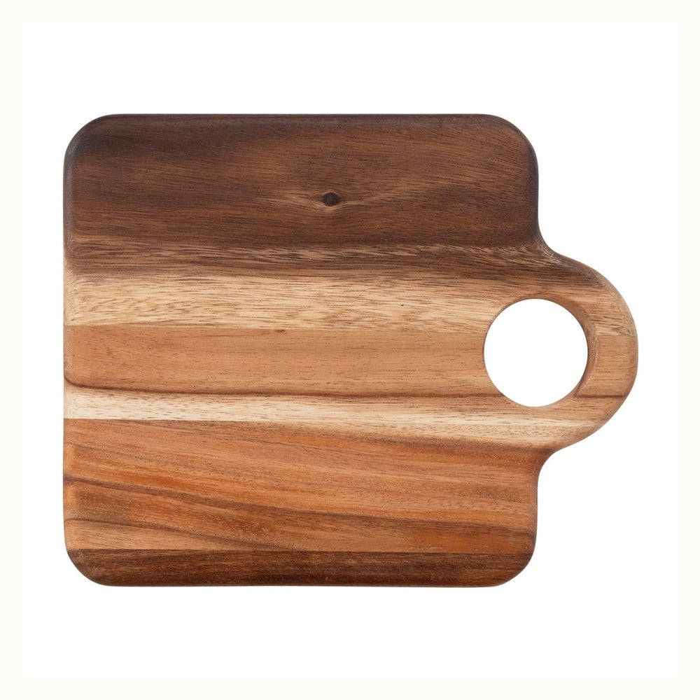 Handcrafted acacia wood serving board set against a white background featuring a square silhouette with a circular handle and prominent horizontal wood grain transitions from deep chocolate to light amber tones