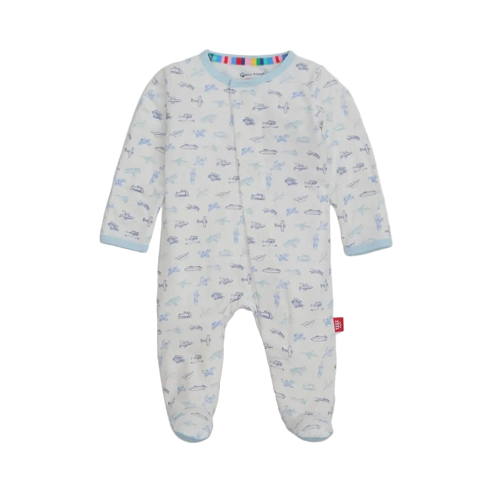Product photograph of a Magnetic Me baby footie on a white background featuring an all-over blue airplane print with light blue trim and a colorful rainbow-striped inner collar