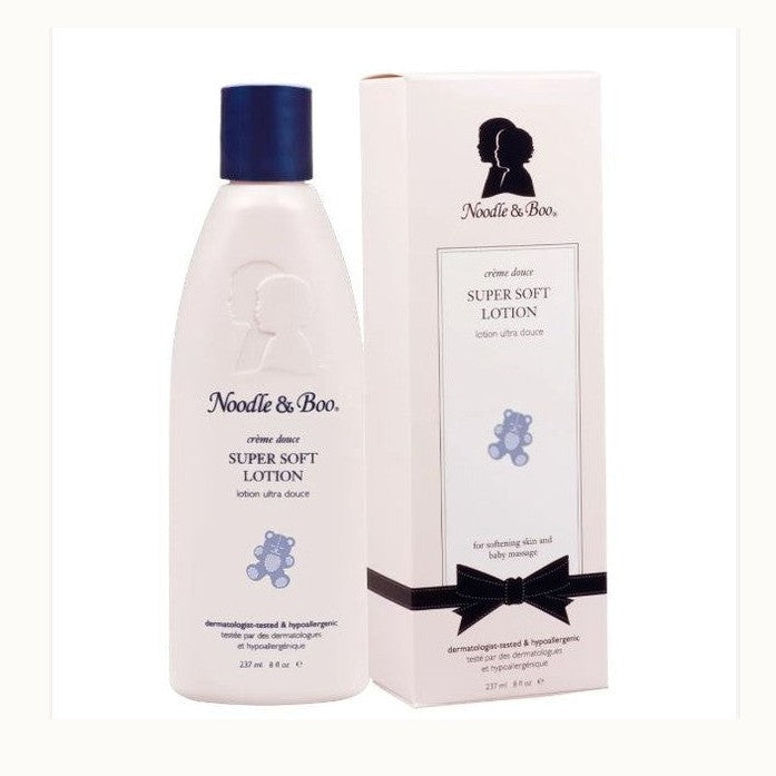 Product photograph of Noodle & Boo Super Soft Lotion displaying a 237ml bottle and packaging box on a white background with a navy blue screw cap, the signature mother and child silhouette logo, and a blue teddy bear graphic