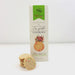 Product photograph by TooGoodGourmet of Cake Batter Crisp Confetti Cookies on a white background featuring a prominent green brand banner, a stack of round speckled biscuits, and colorful rainbow sprinkles