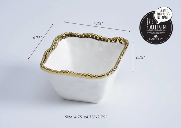 Porcelain bowl by Pampa Bay featuring a square dish on a white studio background with a metallic beaded gold titanium rim, organic wavy edges, and labeled dimensions of 4.75 by 4.75 by 2.75 inches