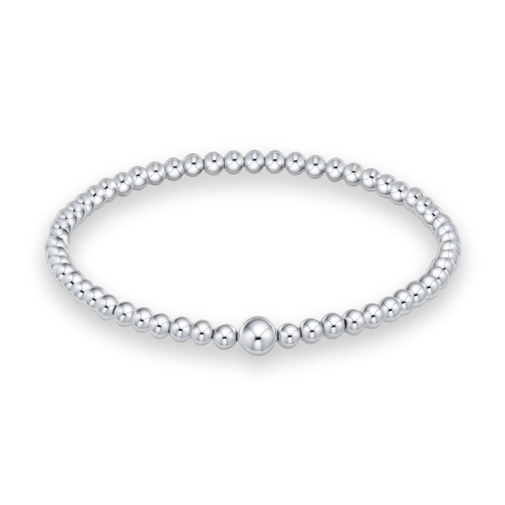 Polished sterling silver bead bracelet by an unidentified artist showcased on a white background featuring uniform high-shine spheres and a single prominent larger centerpiece bead at the bottom center