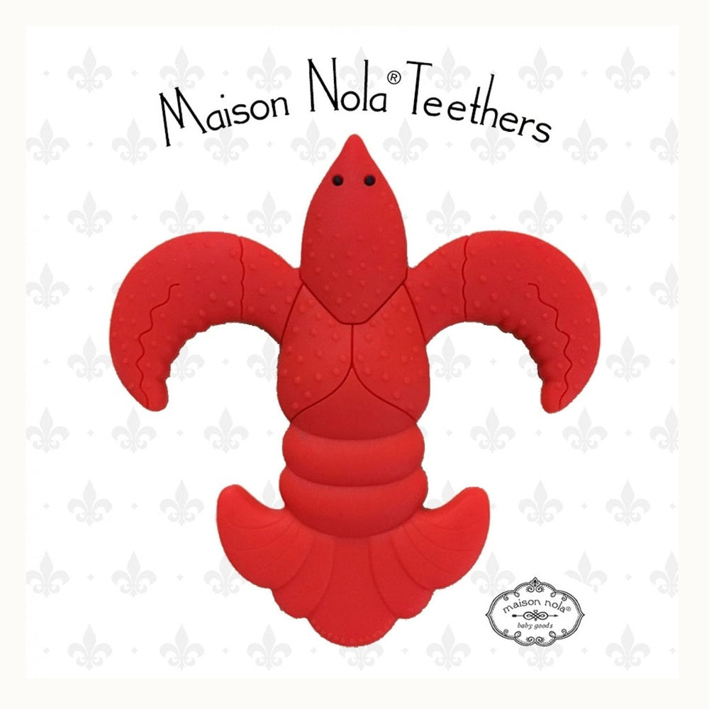 Silicone baby teether by Maison Nola featuring a vibrant red New Orleans crawfish shaped into an iconic fleur-de-lis with a bumpy sensory texture and segmented tail