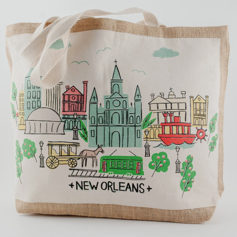 Canvas and jute tote printed with a colorful New Orleans scene of a cathedral, streetcar, steamboat and carriage