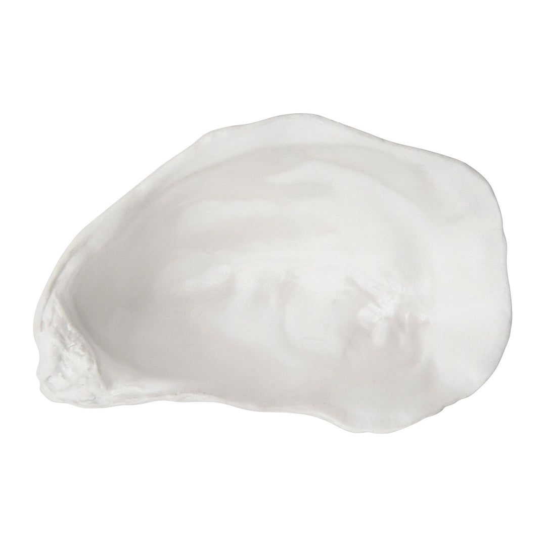 Ceramic oyster shell bowl on a white background featuring a luminous pearl glaze and realistic organic ridges along its scalloped edges