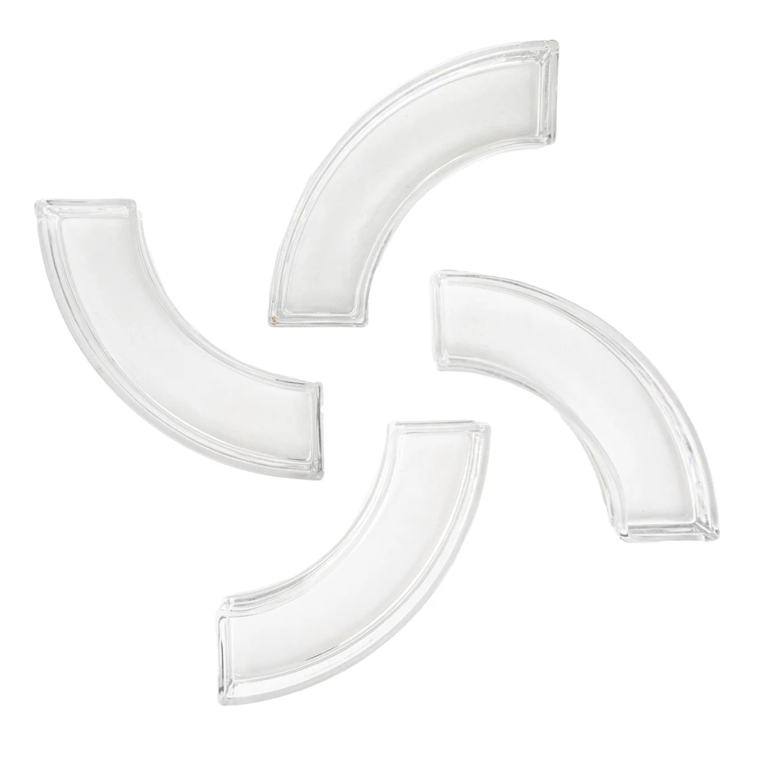 Clear glass modular centerpiece segments featuring four curved hollow pieces arranged in a pinwheel formation against a white background with translucent beveled edges and a minimalist geometric aesthetic