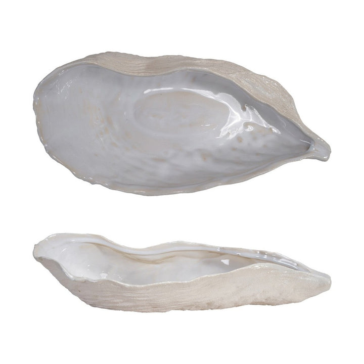 Ceramic decorative oyster-shaped bowls displayed in top and profile views against a white background featuring a smooth iridescent glazed interior and a rough textured beige exterior with organic wavy edges