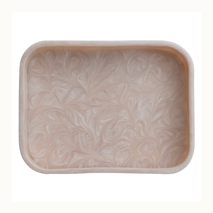 Resin rectangular tray featuring iridescent champagne swirls, a soft blush pink hue, and smooth rounded corners isolated on a white background