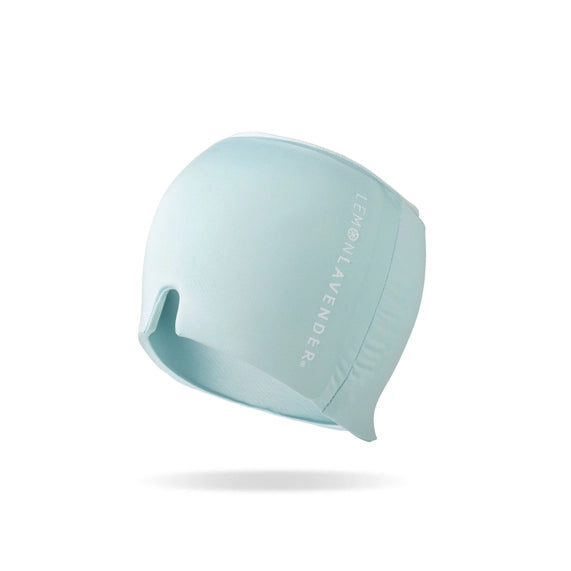 Studio product photograph by Lemon Lavender of a mint blue head wrap on a white background featuring the vertical white logo and a distinctive V-shaped nose notch