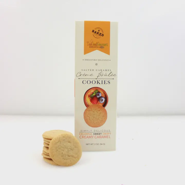 Too Good Gourmet Salted Caramel Crème Brûlée Cookies box beside a stack of thin cookies