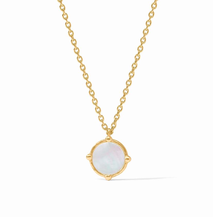 Gold-tone jewelry necklace featuring a circular mother-of-pearl pendant centered on a white background with a shimmering iridescent surface, four gold bead accents at the compass points, and a delicate cable chain