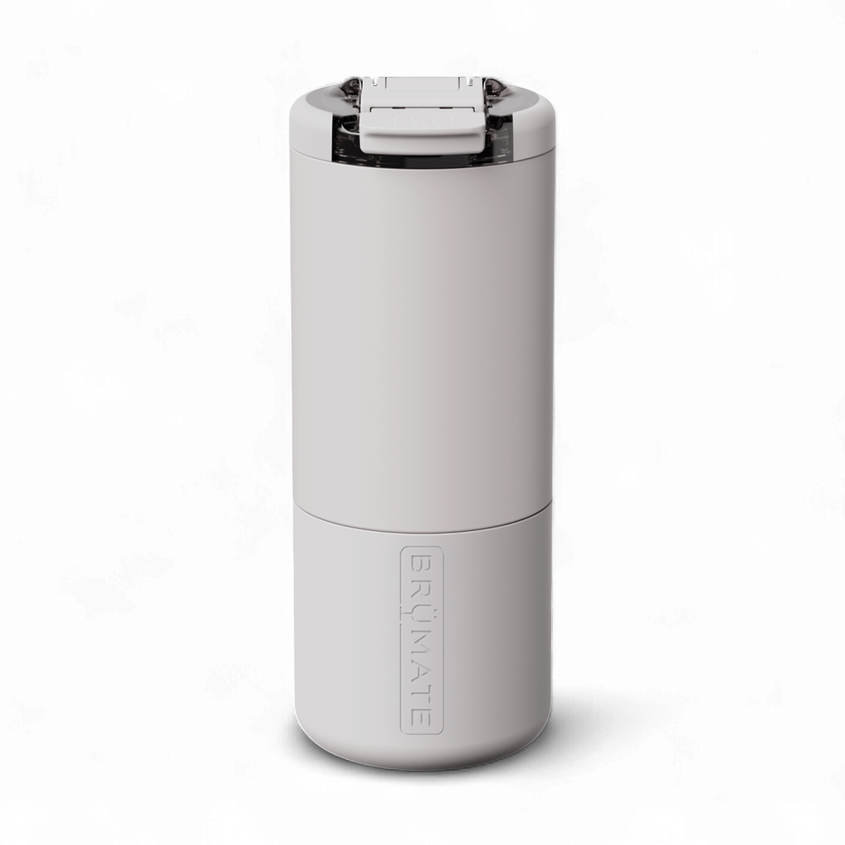 Commercial studio photograph by BrüMate of a matte light gray insulated can cooler on a plain white background featuring a translucent flip-top lid and a vertical embossed brand logo on the cylindrical base