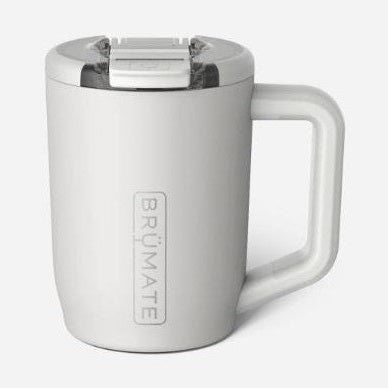 Product photography by BrüMate of a matte white insulated travel mug in a studio setting featuring a vertical embossed logo, a clear splash-proof lid with a sliding latch, and an ergonomic handle