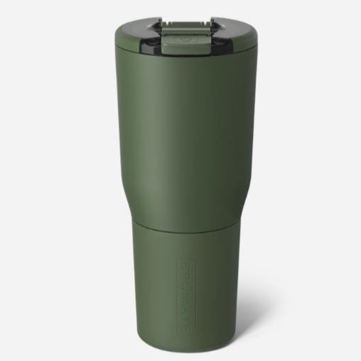 Product photograph of a BrüMate insulated tumbler showcasing a matte olive green travel mug against a neutral background with a secure flip-top lid and a tapered base featuring an embossed logo