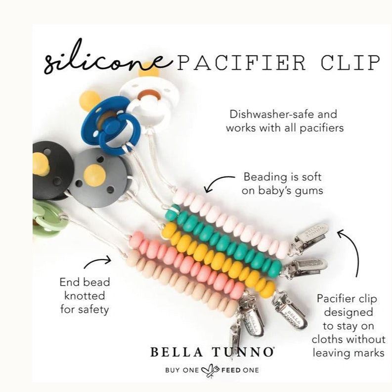 Product photography by Bella Tunno featuring several silicone beaded pacifier clips in teal, yellow, and blush pink with silver metal fasteners and attached pacifiers on a white background
