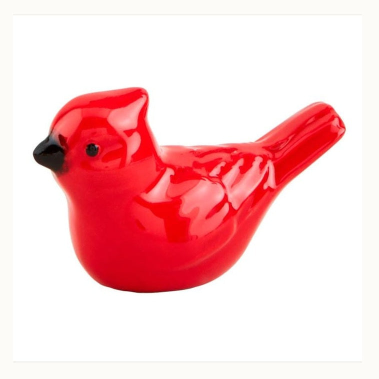 Ceramic figurine of a vibrant red cardinal bird against a plain white background showcasing a glossy finish, a short black beak, and a distinctive tufted crest