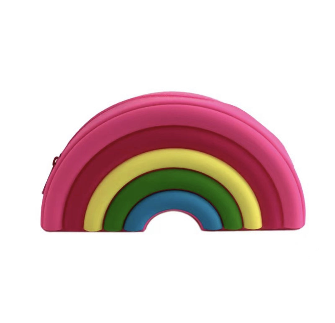 Silicone rainbow-shaped pouch on a white background featuring vibrant layered arches in pink, red, yellow, green, and blue with a small side zipper closure