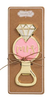 Enamel and gold metal bottle opener by Mud Pie featuring an engagement ring design on a brown cardboard gift card with a pink center displaying cursive gold Mrs lettering, a shimmering glitter diamond accent, and a rustic twine bow