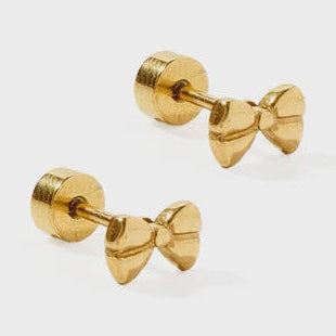Gold-toned metal bow-shaped stud earrings featuring a polished reflective finish and secure flat-back disc closures on a light gray background