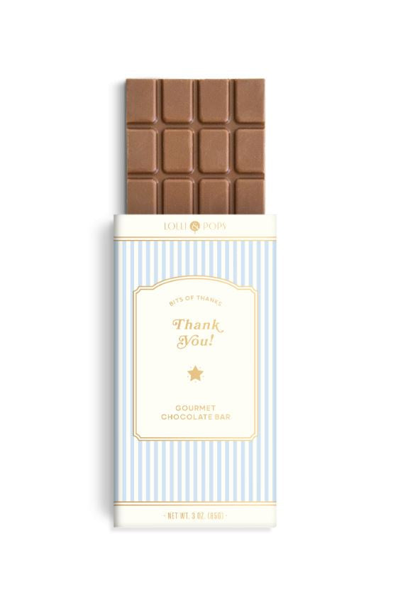 Product photograph by Lolli &amp; Pops of a grid-patterned milk chocolate bar on a white background featuring a light blue and white striped wrapper with gold foil Thank You script and a small gold star