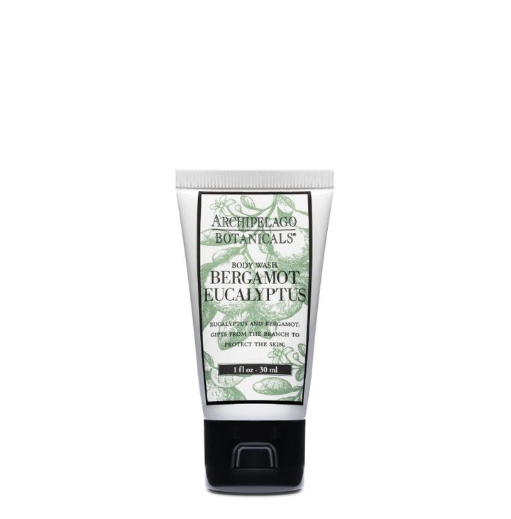 Product photograph by Archipelago Botanicals of a Bergamot Eucalyptus body wash tube centered on a white background, featuring pale green botanical illustrations, bold black serif typography, and a matte black flip-top cap