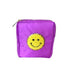 Nylon fabric accessory pouch featuring a textured yellow chenille smiley face patch with a sparkling gold sequin border and a gold-tone zipper pull on a white studio background