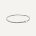 Sterling silver beaded bracelet featuring a single minimalist square cube charm and rows of tiny polished spheres centered on a neutral studio background
