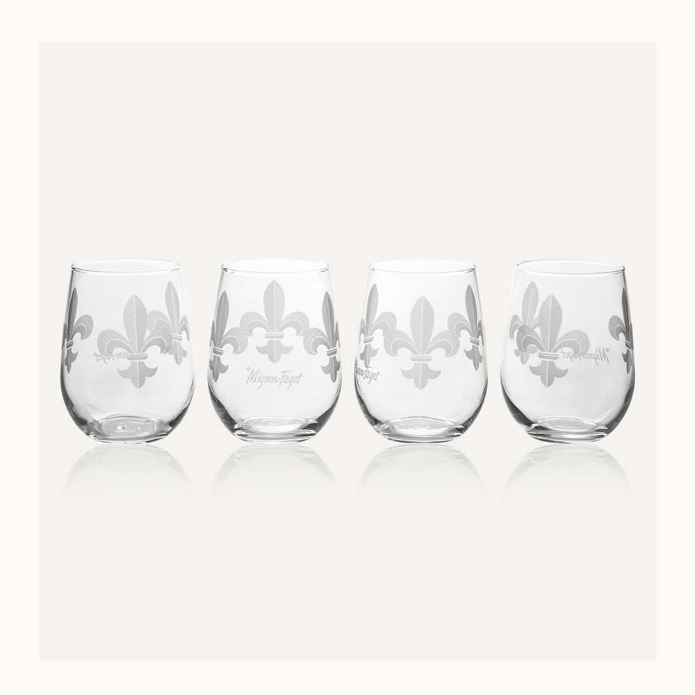 Four stemless wine glasses etched with fleur-de-lis