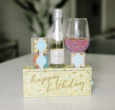 Sugarfina, Courtage champagne, and wine glass birthday gift basket.