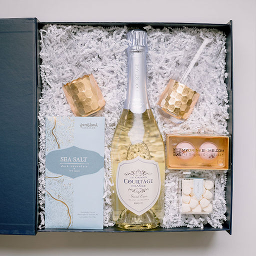 Brut Champagne gift box with champagne flutes and snacks